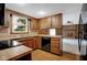 Classic kitchen with wood cabinets, ample counter space, and modern appliances at 3235 Flintwood Dr, Columbus, IN 47203