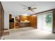A bright living room is highlighted by the direct sight lines into the connected kitchen at 3235 Flintwood Dr, Columbus, IN 47203