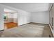 Spacious carpeted living room with natural light, offering a comfortable and inviting atmosphere at 3235 Flintwood Dr, Columbus, IN 47203