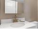 Updated bathroom featuring modern sink, faucet, white cabinetry, and storage at 330 S Green St, Brownsburg, IN 46112