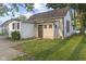 The rear of a charming two-story home with a well-maintained lawn at 330 S Green St, Brownsburg, IN 46112