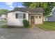 The rear of a charming two-story home with a long concrete driveway at 330 S Green St, Brownsburg, IN 46112