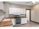 Efficient kitchen with white cabinets, modern appliances, and durable floors at 330 S Green St, Brownsburg, IN 46112