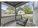 Cozy porch with a hanging porch swing and decorative string lights at 330 S Green St, Brownsburg, IN 46112