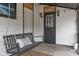 Cozy porch with a hanging porch swing and decorative string lights at 330 S Green St, Brownsburg, IN 46112