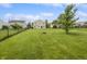 Expansive backyard featuring a fire pit and a fenced yard at 3445 Brandenburg Blvd, Indianapolis, IN 46239
