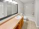 Clean and bright bathroom with a vanity, toilet, and a shower-tub combo at 3445 Brandenburg Blvd, Indianapolis, IN 46239