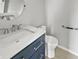 Updated bathroom with a modern vanity, sink, and fixtures, along with a toilet and grab bar at 3445 Brandenburg Blvd, Indianapolis, IN 46239