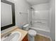 Traditional bathroom featuring a vanity sink, toilet, and shower-tub combo for complete functionality at 3445 Brandenburg Blvd, Indianapolis, IN 46239