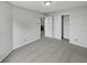 Neutral bedroom with grey walls, carpet, and a closet with white doors provides a calm and serene space at 3445 Brandenburg Blvd, Indianapolis, IN 46239