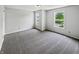 Bright bedroom with two windows allowing ample natural light, neutral walls and carpet flooring at 3445 Brandenburg Blvd, Indianapolis, IN 46239