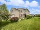 Charming two-story home featuring a two-car garage, brick accents, and manicured lawn at 3445 Brandenburg Blvd, Indianapolis, IN 46239