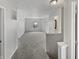 Upstairs hallway featuring carpet flooring and access to several rooms, with natural light at 3445 Brandenburg Blvd, Indianapolis, IN 46239