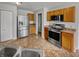 Kitchen featuring stainless steel appliances, wood cabinets, and tile flooring at 3445 Brandenburg Blvd, Indianapolis, IN 46239