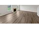 Bright living room featuring an elegant fireplace and hardwood flooring at 3445 Brandenburg Blvd, Indianapolis, IN 46239
