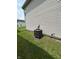 Side view showing outdoor AC unit and exterior design at 4264 Village Trace Dr, Indianapolis, IN 46254