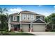 Charming two-story home featuring a three-car garage, inviting entry, and beautifully landscaped yard at 4370 Red Pine Dr, Bargersville, IN 46106