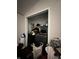 Washer and dryer alcove with clothing and supplies visible on shelves at 4607 Melrose Ave, Indianapolis, IN 46241