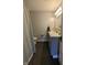 Modern bathroom featuring gray vanity, white countertop, and a tiled shower with curtain at 4740 Milton St, Coatesville, IN 46121