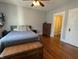 Comfortable bedroom with hardwood floors, ample natural light, and classic furniture at 4740 Milton St, Coatesville, IN 46121