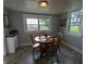 Cozy dining area features natural light, gray walls, and wood table with chairs at 4740 Milton St, Coatesville, IN 46121