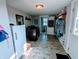 Laundry room featuring a utility sink, modern appliances, and access to the backyard at 4740 Milton St, Coatesville, IN 46121