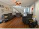 Comfortable living room featuring a sectional sofa, recliner, and hardwood flooring at 4740 Milton St, Coatesville, IN 46121
