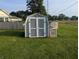 View of outbuilding with double doors, surrounded by a lush green lawn at 4740 Milton St, Coatesville, IN 46121