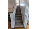 Carpeted staircase with white railing leading to the upper level at 4740 Milton St, Coatesville, IN 46121