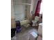 A cluttered bathroom with a shower/tub combination, toilet, and a window at 489 W Sumner Ave, Martinsville, IN 46151