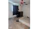 This bedroom has hardwood floors, a window with black curtains and a Coca-Cola ceiling fan at 489 W Sumner Ave, Martinsville, IN 46151