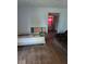 This bedroom has hard wood floors and a door leading to another room at 489 W Sumner Ave, Martinsville, IN 46151