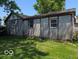 View of the side of a building featuring weathered paneling and trim at 489 W Sumner Ave, Martinsville, IN 46151