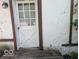 Exterior view of weathered back door with glass inserts and peeling paint at 489 W Sumner Ave, Martinsville, IN 46151