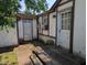 View of exterior side of house, showing multiple doors and peeling paint at 489 W Sumner Ave, Martinsville, IN 46151