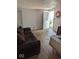 Living room with hardwood floors and a door leading to the outside at 489 W Sumner Ave, Martinsville, IN 46151