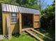 View of interior of storage shed with metal roof and ramp at 489 W Sumner Ave, Martinsville, IN 46151