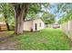 Backyard featuring a shed, a large tree, and ample green space at 504 Broadway Ave, Arcadia, IN 46030