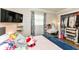Bedroom with an open closet, built-in desk and vanity, and a mounted television at 504 Broadway Ave, Arcadia, IN 46030