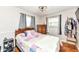 Cozy bedroom with hardwood floors, neutral walls, and natural light from the windows at 504 Broadway Ave, Arcadia, IN 46030