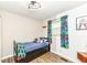 Bright bedroom with blue accents and a playful design for a joyful atmosphere at 504 Broadway Ave, Arcadia, IN 46030