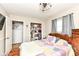 Charming bedroom with wood floors, closet, and neutral walls for a serene ambiance at 504 Broadway Ave, Arcadia, IN 46030