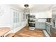 Updated kitchen boasts wood floors, stainless appliances, and updated cabinets and countertops at 504 Broadway Ave, Arcadia, IN 46030