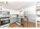 Updated kitchen features stainless steel appliances, modern cabinets, and updated countertops at 504 Broadway Ave, Arcadia, IN 46030