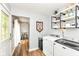 Bright laundry room featuring modern appliances and convenient access to other living spaces at 504 Broadway Ave, Arcadia, IN 46030