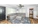 Inviting living room with a comfortable sectional, modern lighting, and stylish decor at 504 Broadway Ave, Arcadia, IN 46030