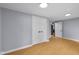 The bedroom features light gray walls and hardwood floors, with a closet and an open doorway at 533 Patterson Rd, Columbus, IN 47203