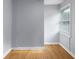 Bedroom with light gray walls, light colored flooring, and a window with blinds at 533 Patterson Rd, Columbus, IN 47203