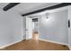 A bedroom with gray walls and wooden support beams in the ceiling at 533 Patterson Rd, Columbus, IN 47203