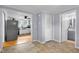 View of dining room leading to kitchen and bathroom and featuring gray walls and laminate floors at 533 Patterson Rd, Columbus, IN 47203
